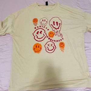 beige smiley graphic